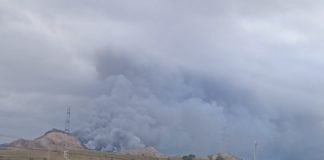Rubbish tip fire still burning