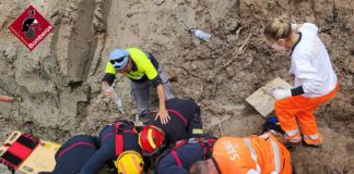 Buried worker dug out of earth tomb